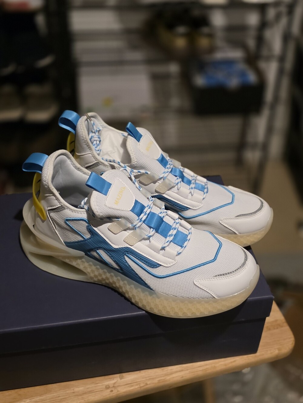 Men's White Sneakers with Blue Accents and Yellow Pull Tabs